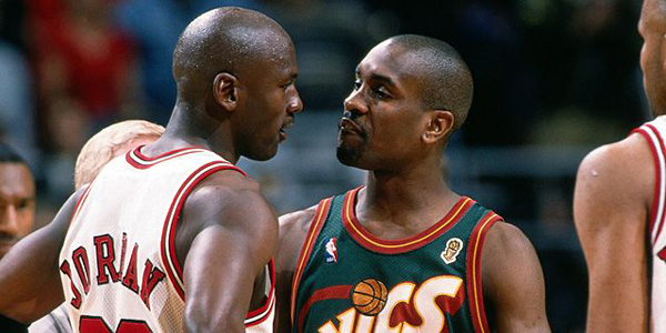 Michael Jordan (left) and Gary Payton (right) amidst a trash talking exchange.