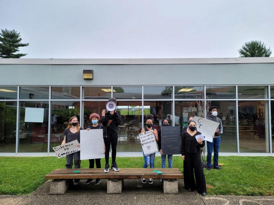 The speakers and main participants at the Equity and Inclusion walkout. The speakers are Brooklyn Williams (third from left w/megaphone), Sophia Angelini (second from right), Gianna Esbensen (behind Sophia), and Kieron Burrell (right). Photo by Sammy Rosin. 